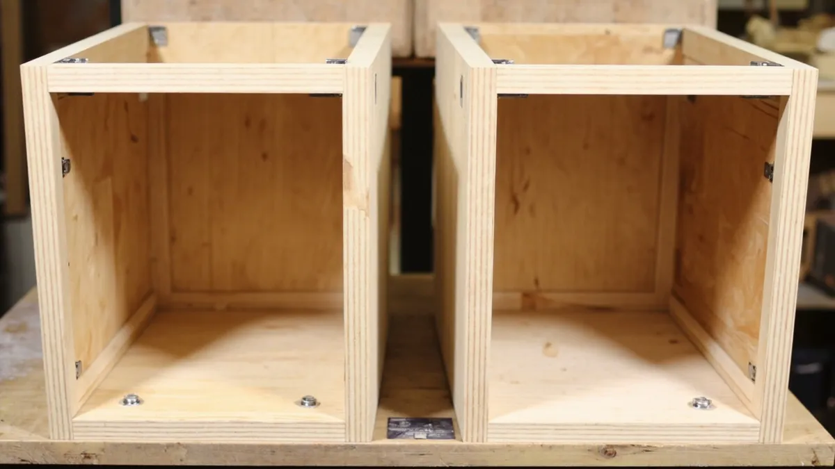 Comparison of a face frame kitchen carcass with stiles and rails beside a frameless European carcass with no front border.