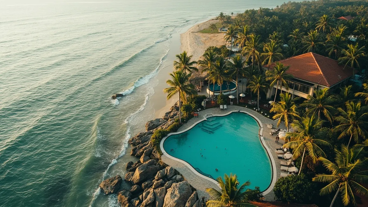 Aerial view of Wind & Wave Villas pool and beach near Pondicherry.